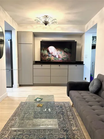 a kitchen with granite countertop a sink and cabinets