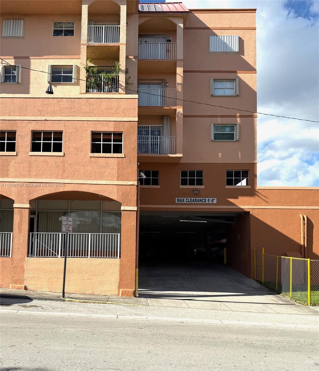 199 Southwest 12th Avenue, Unit 404A Miami, FL 33130 - Photo 59 of 65 a view of a building with car parked