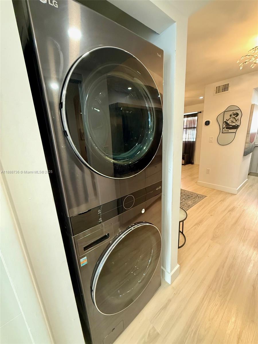 199 Southwest 12th Avenue, Unit 404A Miami, FL 33130 - Photo 9 of 65 a utility room with dryer and washer
