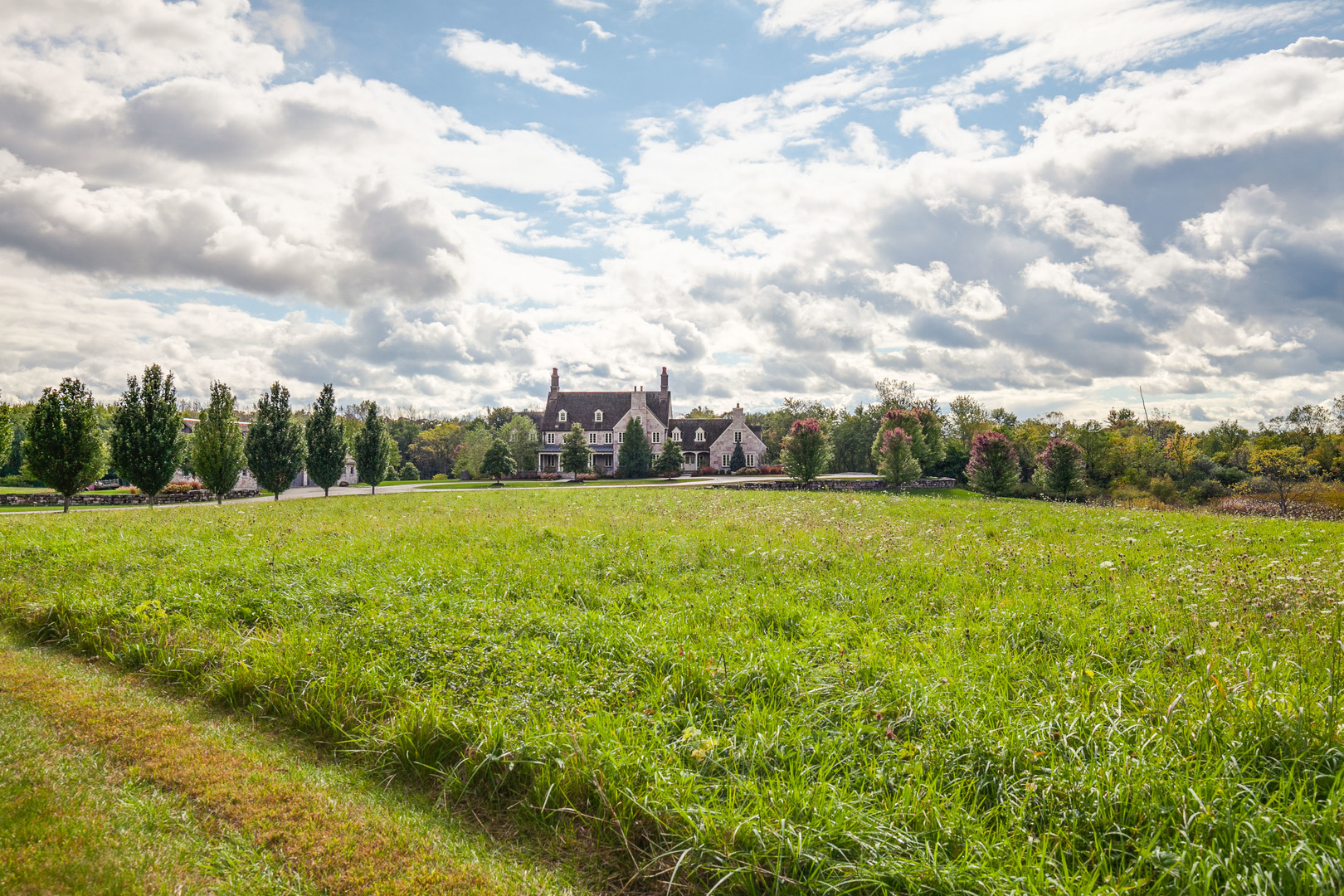 3149 Cuba Road Long Grove, IL 60047 - Photo 12 of 26 a view of a green field with wooden fence