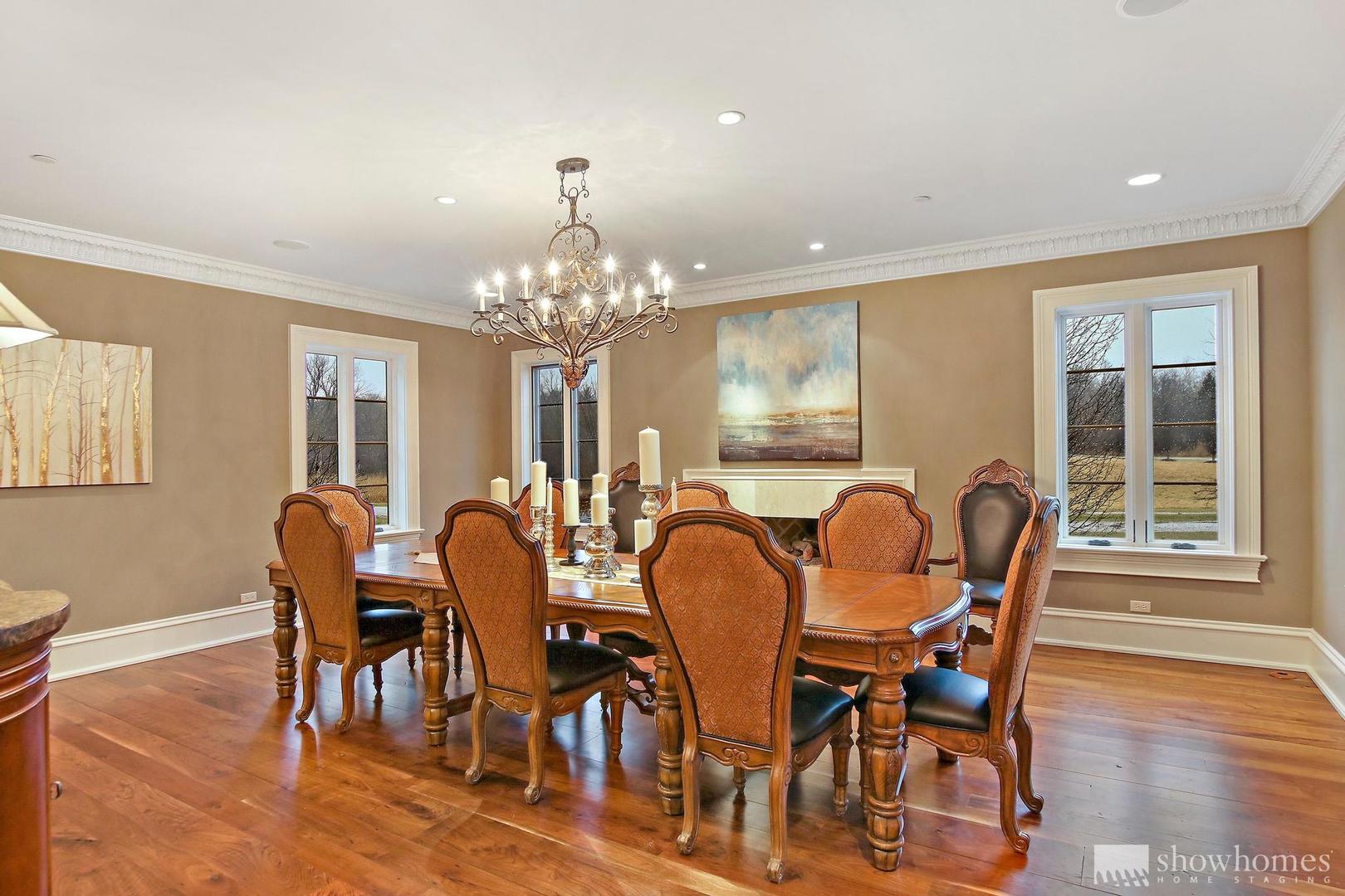 3149 Cuba Road Long Grove, IL 60047 - Photo 13 of 26 a dining room with furniture a chandelier and wooden floor