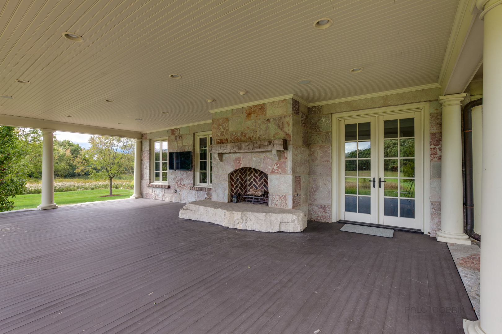 3149 Cuba Road Long Grove, IL 60047 - Photo 9 of 26 a view of an empty room with a fireplace and a large window