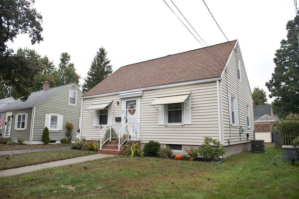 79 Powell Avenue Springfield, MA 01118 - Photo 1 of 20 a view of a house with a yard