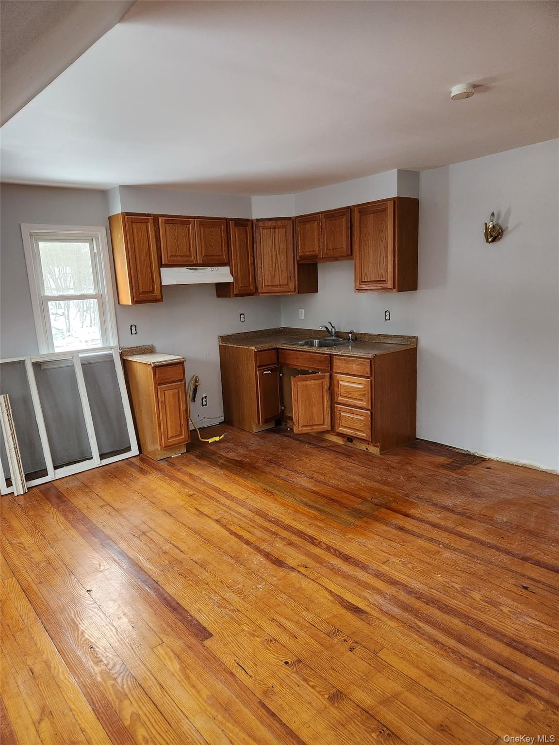 72 Stanton Corner Road, Unit 2 Swan Lake, NY 12783 - Photo 7 of 7 a large kitchen with stainless steel appliances granite countertop a sink dishwasher stove and wooden floor