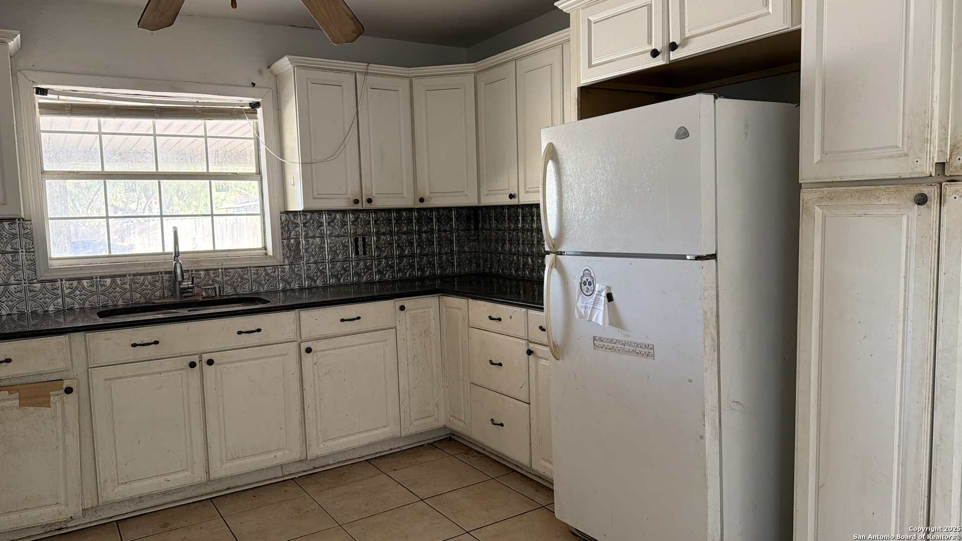 218 Graham Road Kenedy, TX 78119 - Photo 11 of 19 a white refrigerator freezer sitting inside of a kitchen