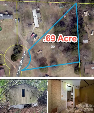 a view of yard with tree in the background