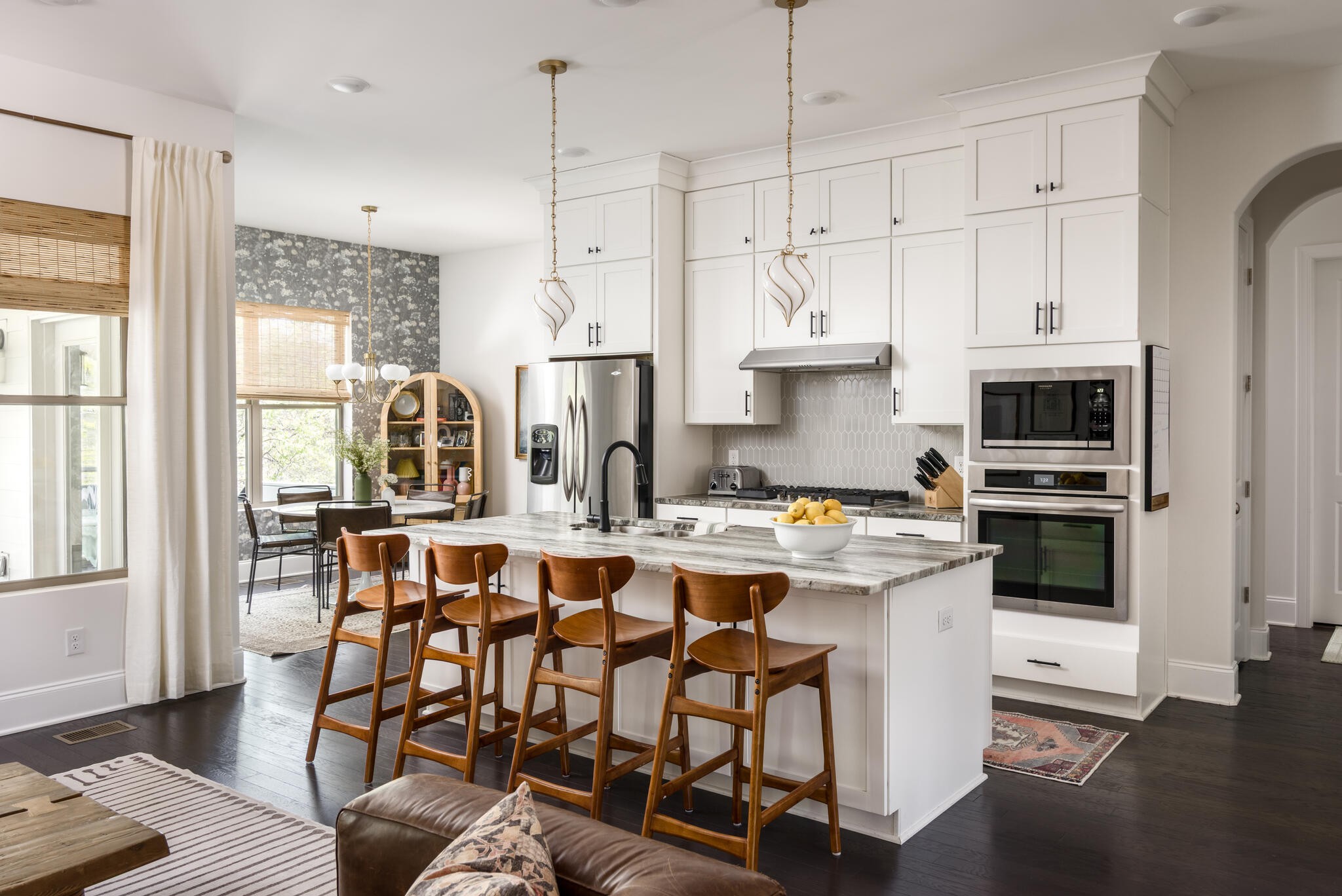 8033 Still Spg Rdg Drive Nashville, TN 37221 - Photo 11 of 36 a kitchen with stainless steel appliances white cabinets and wooden floor