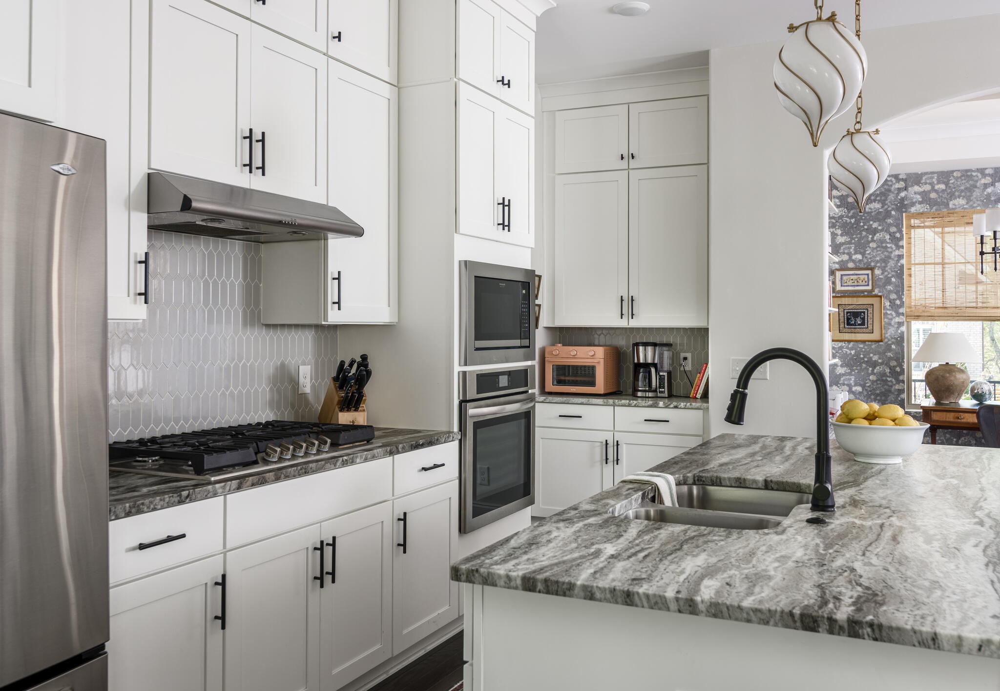 8033 Still Spg Rdg Drive Nashville, TN 37221 - Photo 12 of 36 a kitchen with granite countertop a stove and a refrigerator