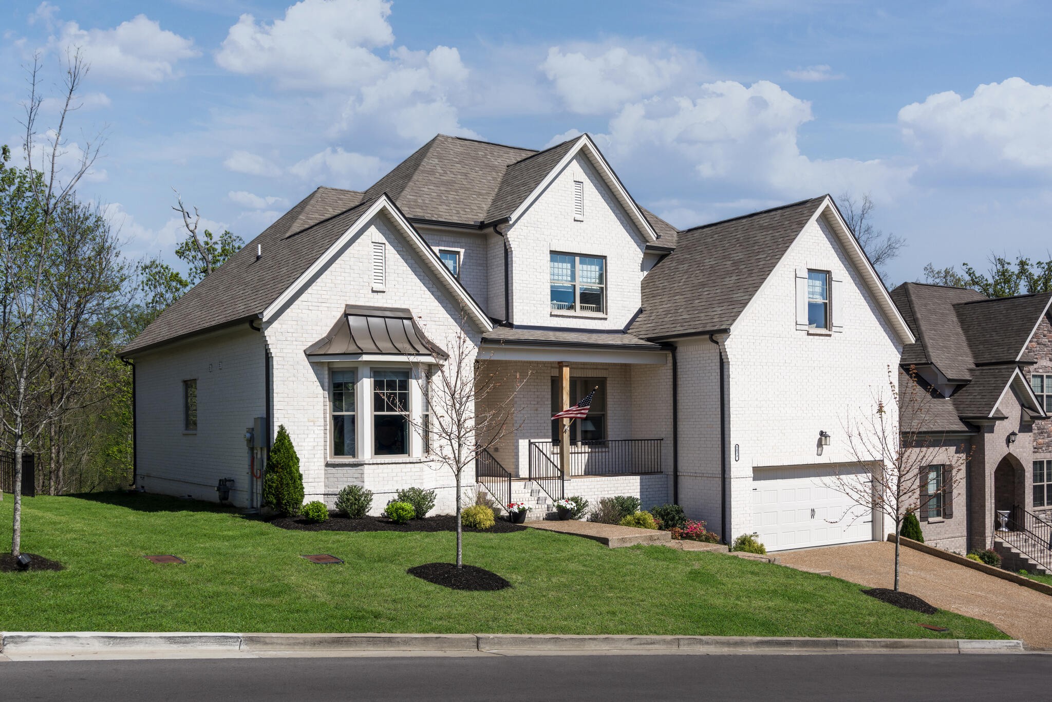 8033 Still Spg Rdg Drive Nashville, TN 37221 - Photo 2 of 36 a front view of a house with a yard