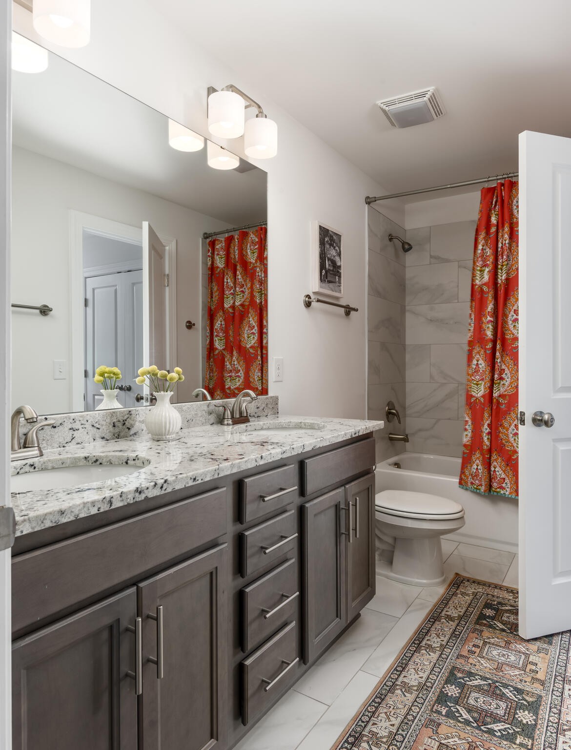 8033 Still Spg Rdg Drive Nashville, TN 37221 - Photo 27 of 36 a bathroom with a granite countertop toilet sink and mirror