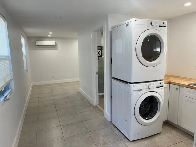 a view of a hallway with washer and dryer