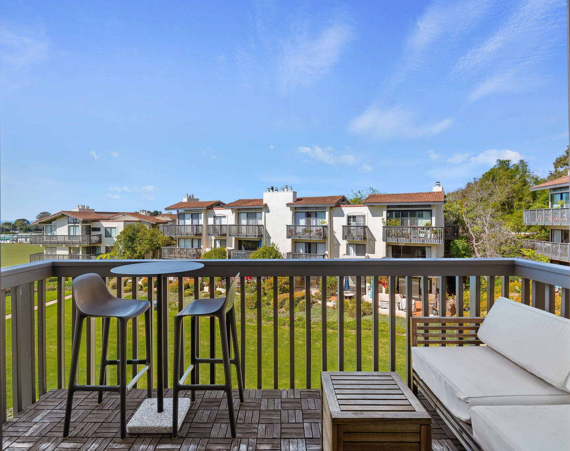 3375 Foothill Road, Unit 233 Carpinteria, CA 93013 - Photo 14 of 21 a view of a chairs and table on the deck