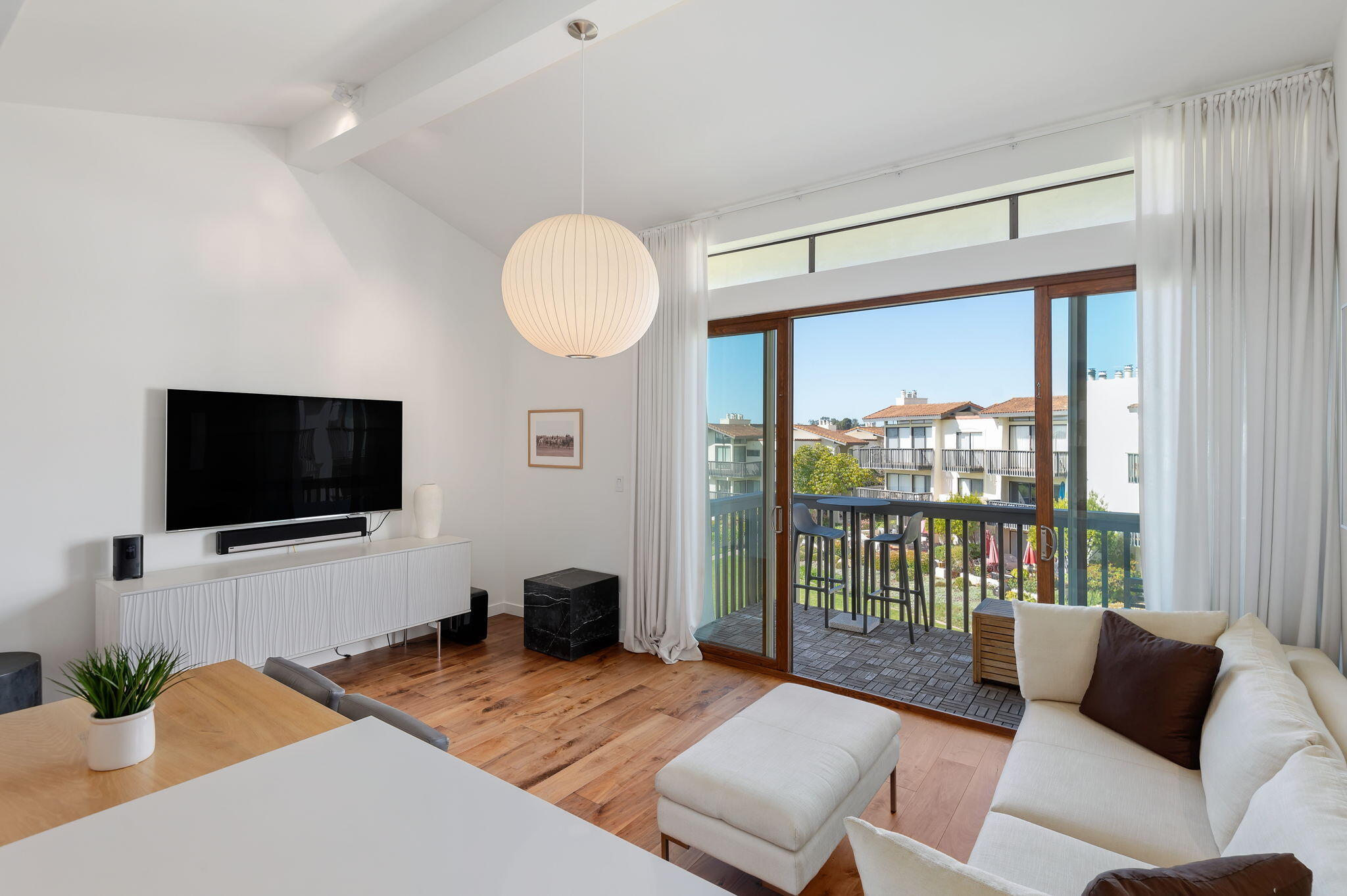 3375 Foothill Road, Unit 233 Carpinteria, CA 93013 - Photo 5 of 21 a living room with furniture and a flat screen tv