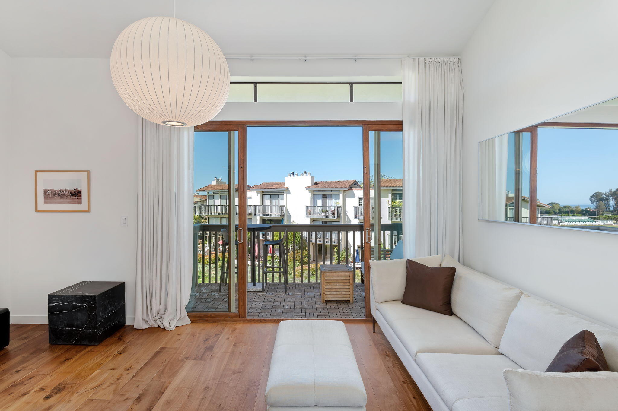 3375 Foothill Road, Unit 233 Carpinteria, CA 93013 - Photo 8 of 21 a living room with furniture and a large window