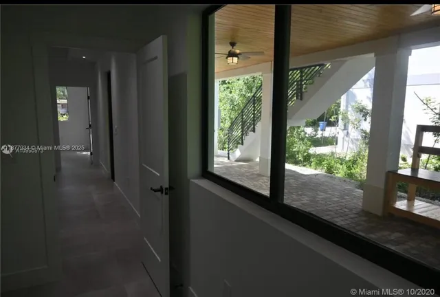 a view of hallway with a large window