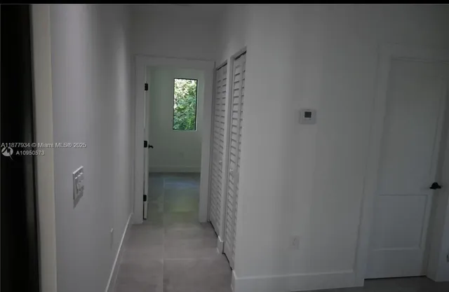 a view of entryway with bathroom