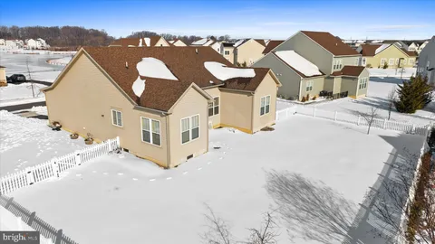 with a view of a swimming pool with outdoor seating