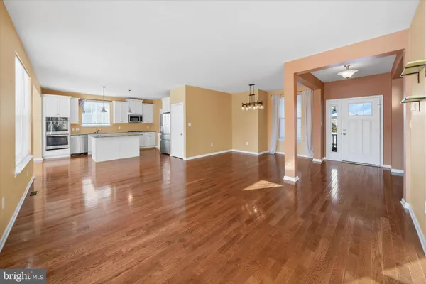 a view of a kitchen with wooden floor
