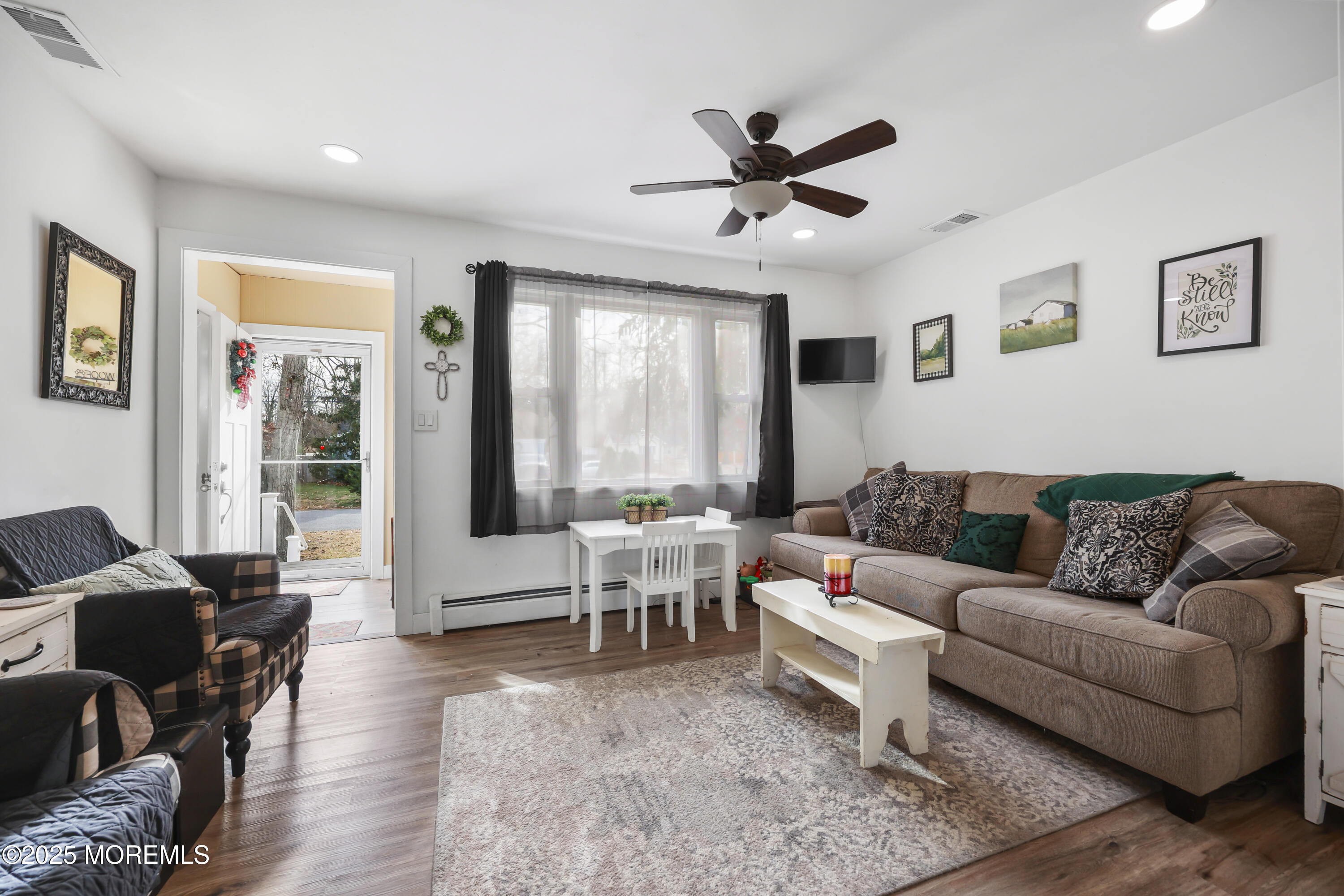 20 Ermack Street Howell, NJ 07731 - Photo 3 of 25 a living room with furniture and a large window