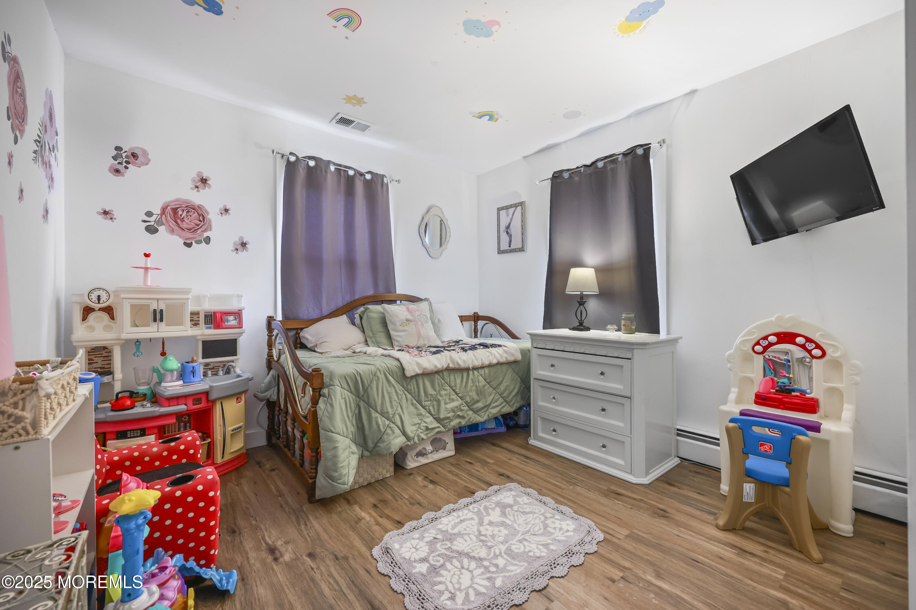 20 Ermack Street Howell, NJ 07731 - Photo 9 of 25 a living room with furniture and a flat screen tv