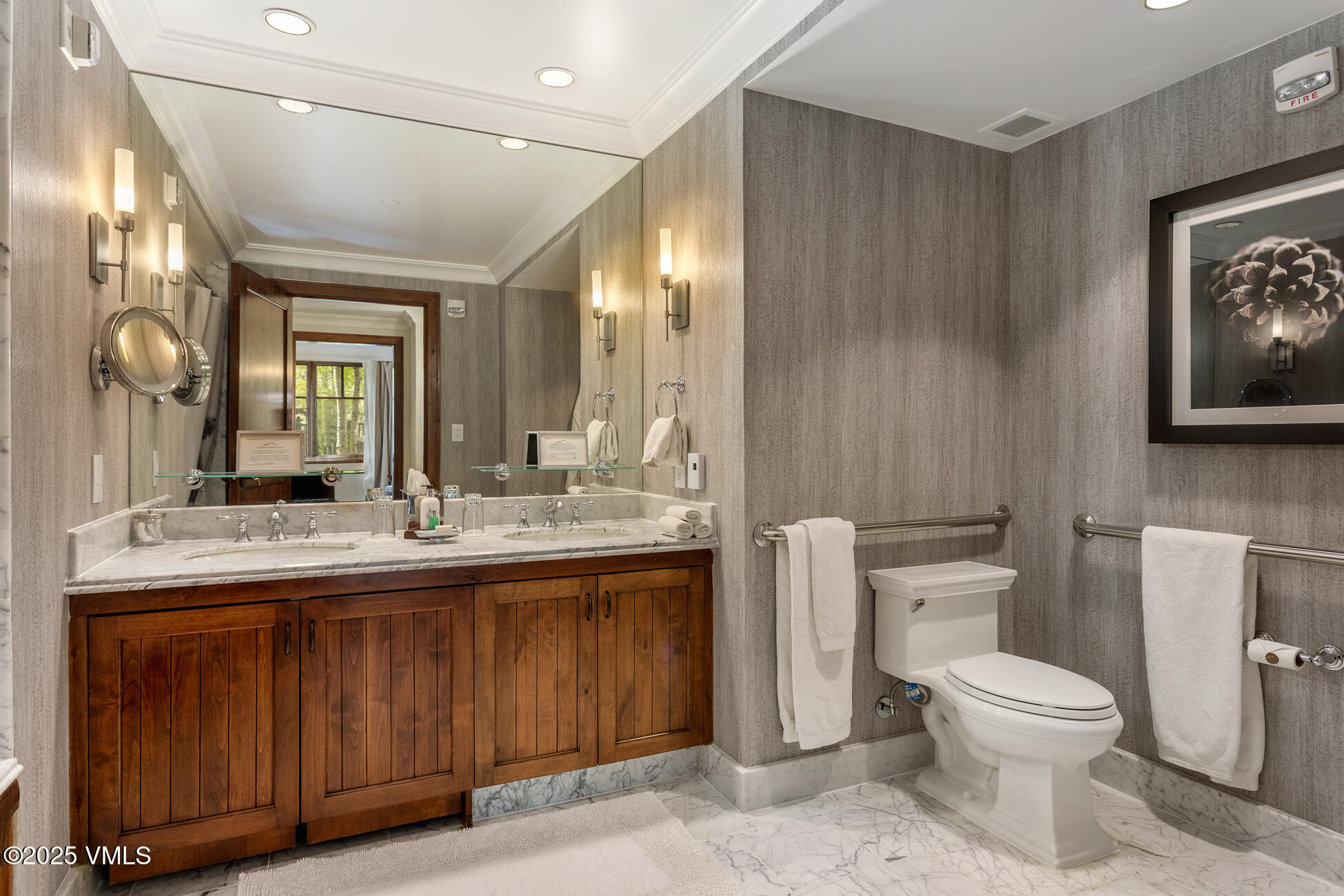 100 Bachelor Ridge Road, Unit 3403 Avon, CO 81620 - Photo 25 of 48 a bathroom with a toilet sink and mirror
