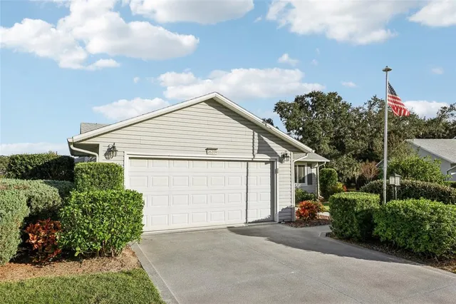 a view of a house with a garden and pathway