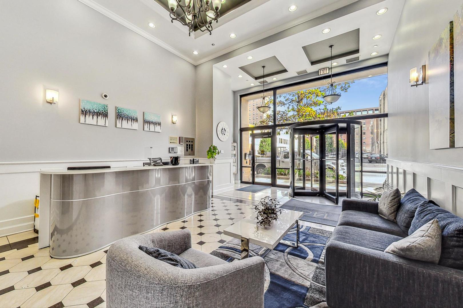 1464 South Michigan Avenue, Unit 1609 Chicago, IL 60605 - Photo 3 of 45 a living room with furniture and a large window