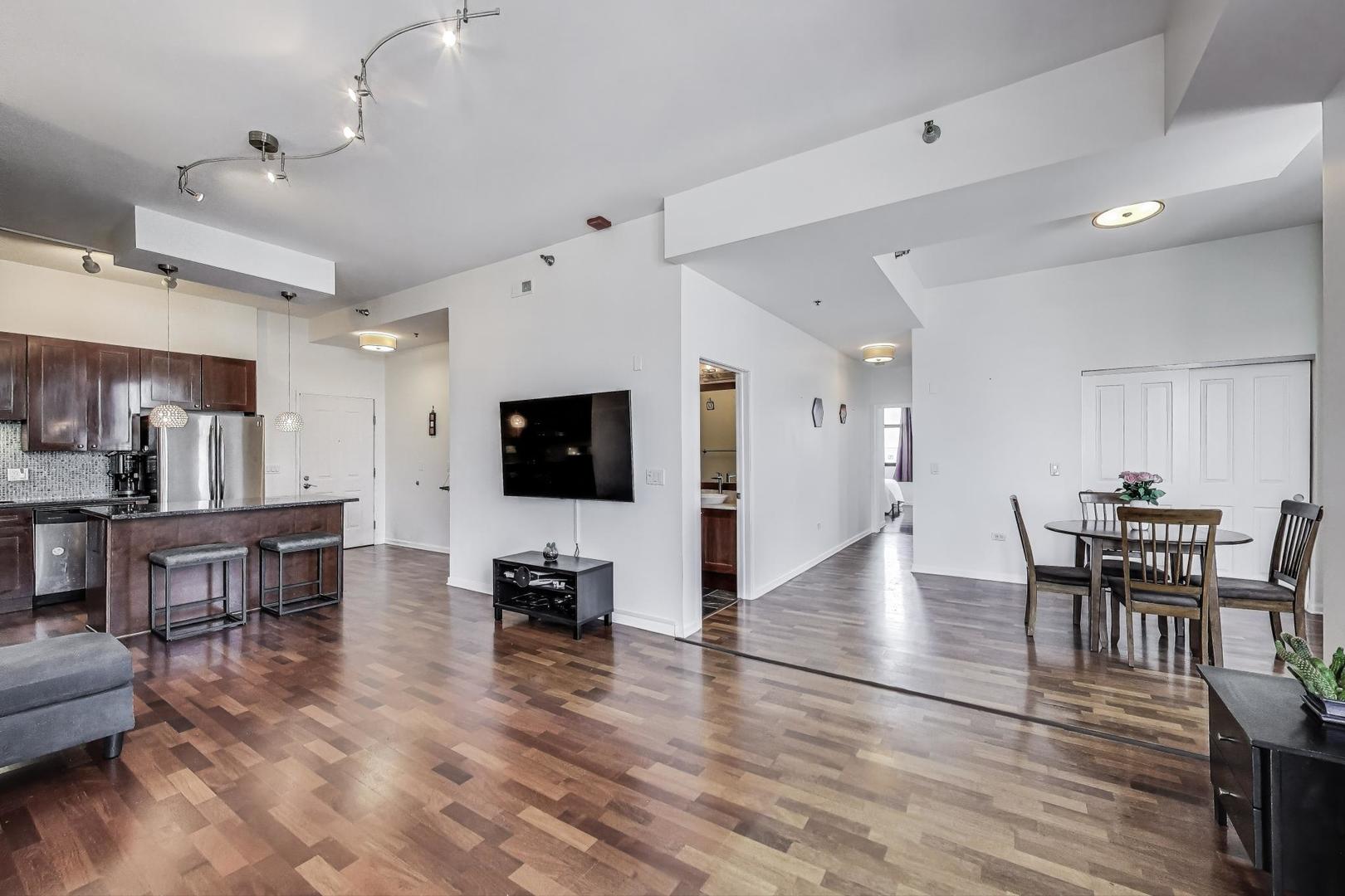 1464 South Michigan Avenue, Unit 1609 Chicago, IL 60605 - Photo 5 of 45 a living room with furniture and a flat screen tv