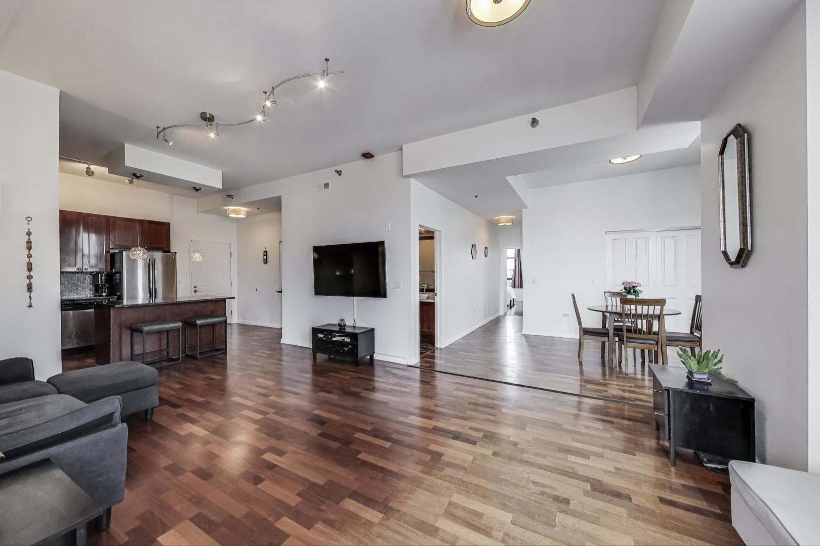 1464 South Michigan Avenue, Unit 1609 Chicago, IL 60605 - Photo 8 of 45 a living room with furniture and a flat screen tv