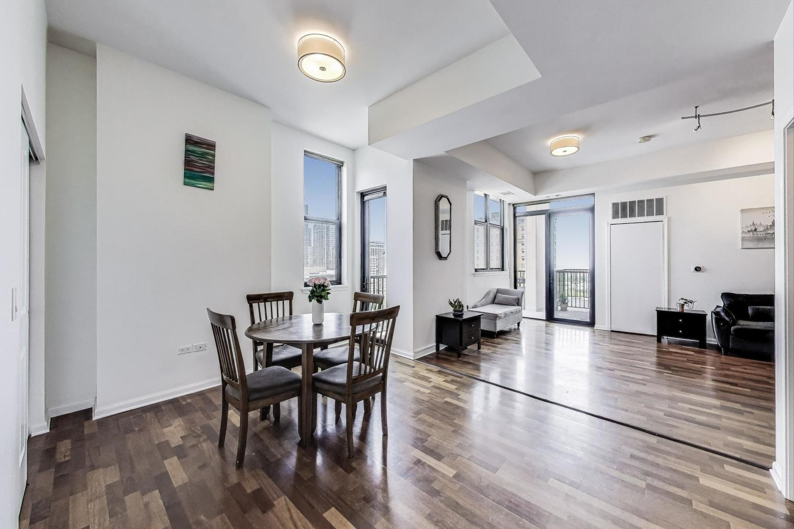 1464 South Michigan Avenue, Unit 1609 Chicago, IL 60605 - Photo 10 of 45 a view of a dining room with furniture and wooden floor