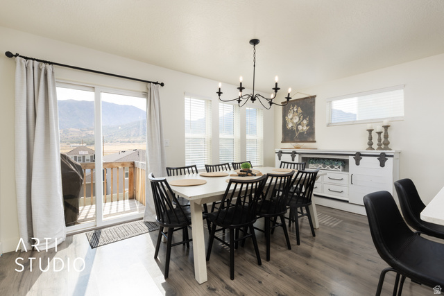 1713 South Windemere Road Santaquin, UT 84655 - Photo 8 of 40 Open concept dining area featuring wood-finish flooring and a contemporary chandelier