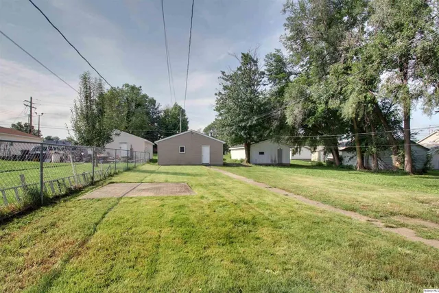 a swimming pool with outdoor space and trees