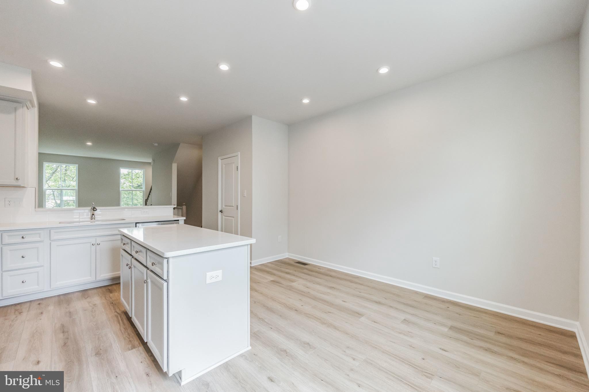 28 Sidney Lane Stratford, NJ 08084 - Photo 13 of 30 a kitchen with a sink and wooden floor