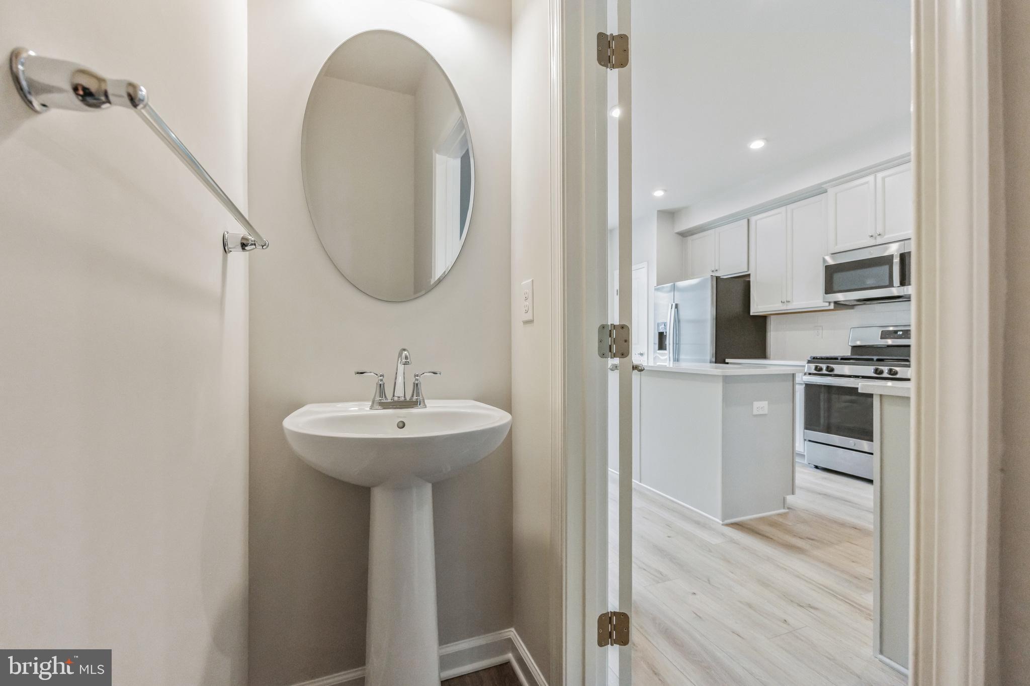 28 Sidney Lane Stratford, NJ 08084 - Photo 14 of 30 a en suite bathroom with a sink and a mirror