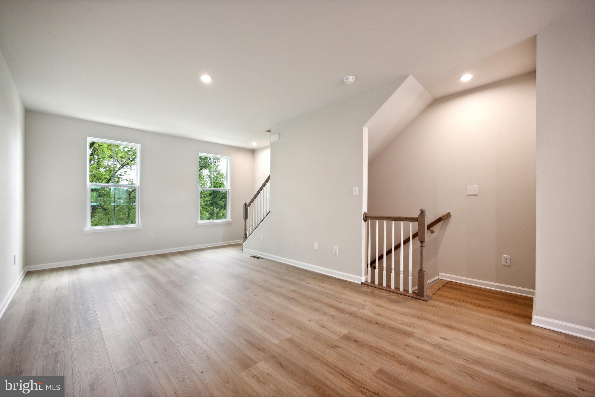 28 Sidney Lane Stratford, NJ 08084 - Photo 16 of 30 a view of an empty room with wooden floor and a window