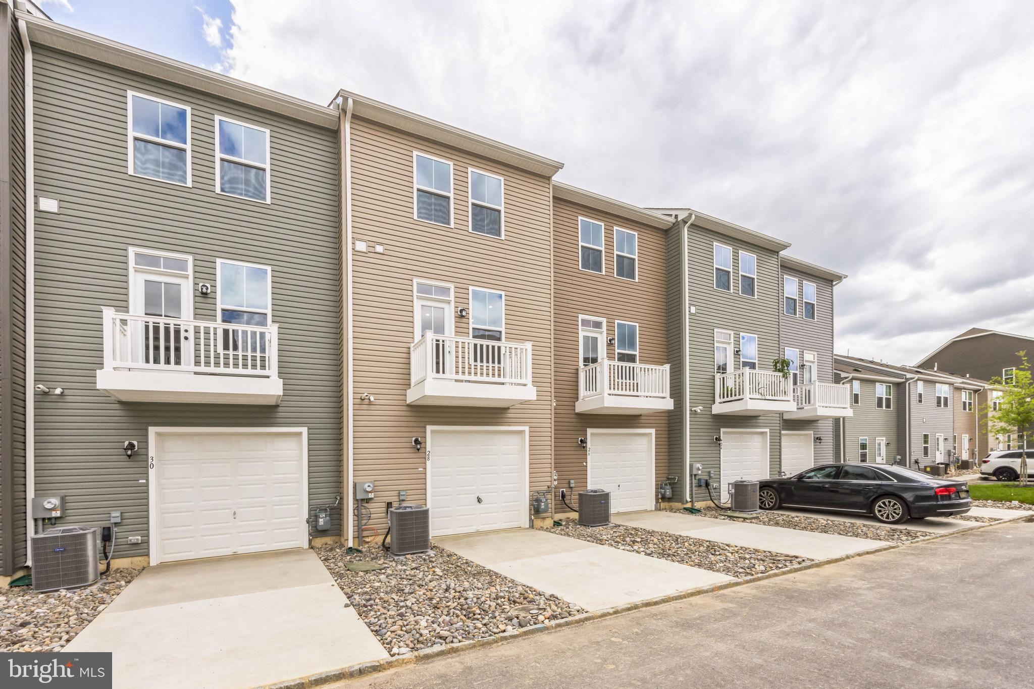 28 Sidney Lane Stratford, NJ 08084 - Photo 30 of 30 a view of a building with car parked