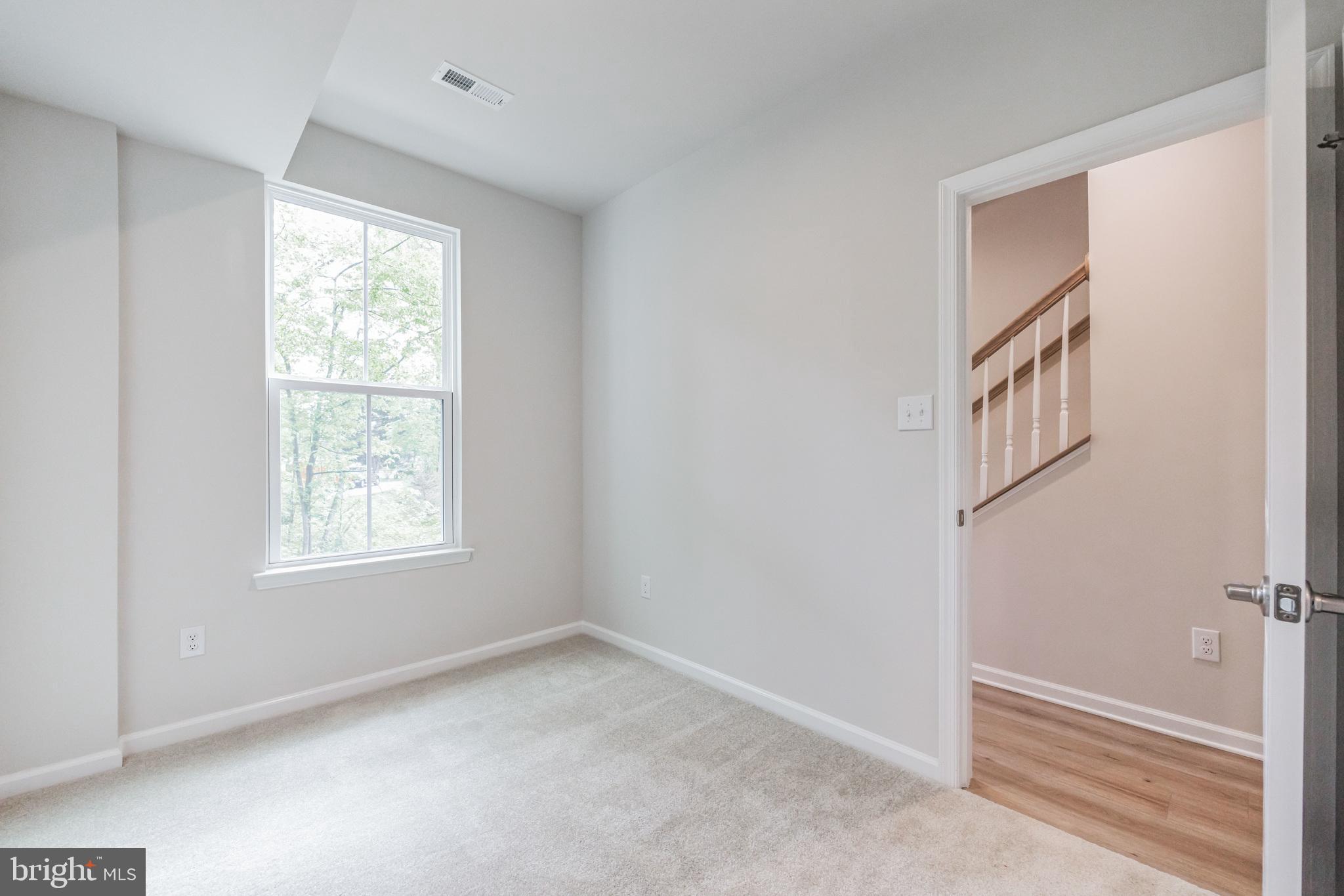 28 Sidney Lane Stratford, NJ 08084 - Photo 5 of 30 a view of an empty room and a window