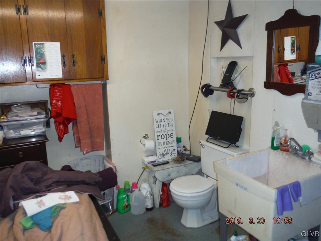 464 Albert Road Wind Gap, PA 18091 - Photo 44 of 45 a bathroom with a toilet sink and mirror