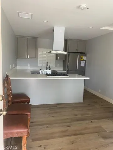 a kitchen with stainless steel appliances a sink and cabinets