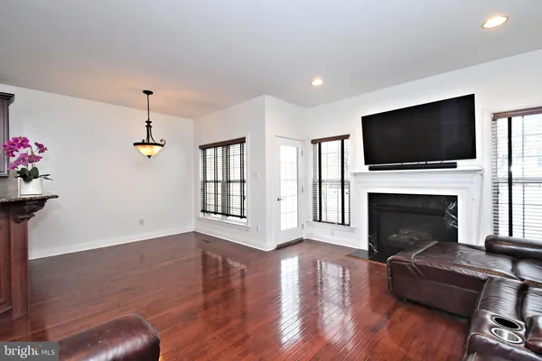 a living room with furniture fireplace and flat screen tv