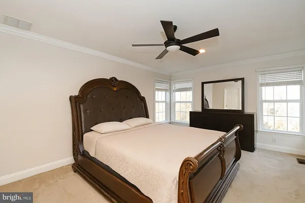 a bed room with a bed and a window