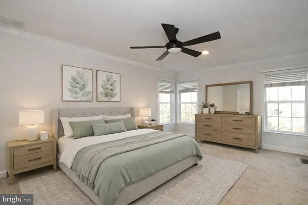 a bed room with a bed and a window