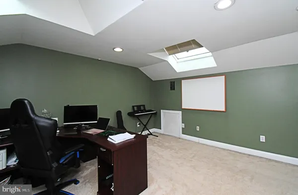 a view of a workspace with furniture
