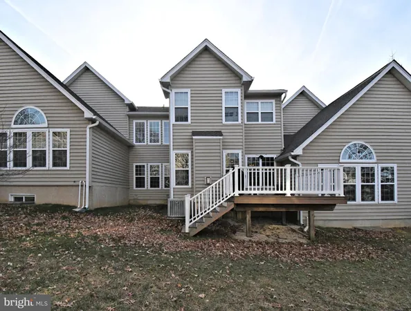 a house with a deck and a yard