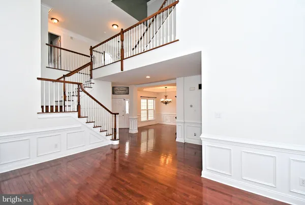 a view of entryway with wooden floor