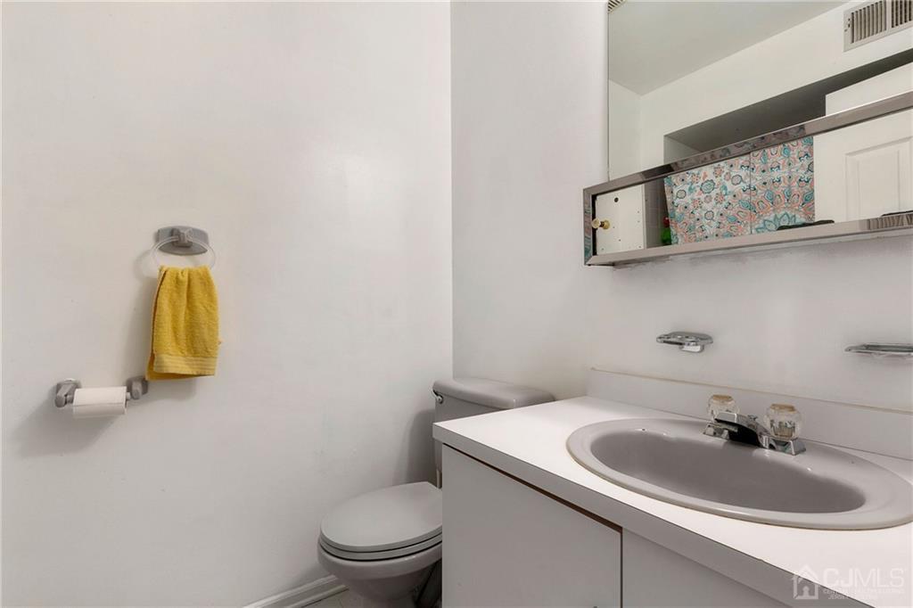 461 Cottrell Road Old Bridge, NJ 08857 - Photo 15 of 21 a bathroom with a sink and a toilet