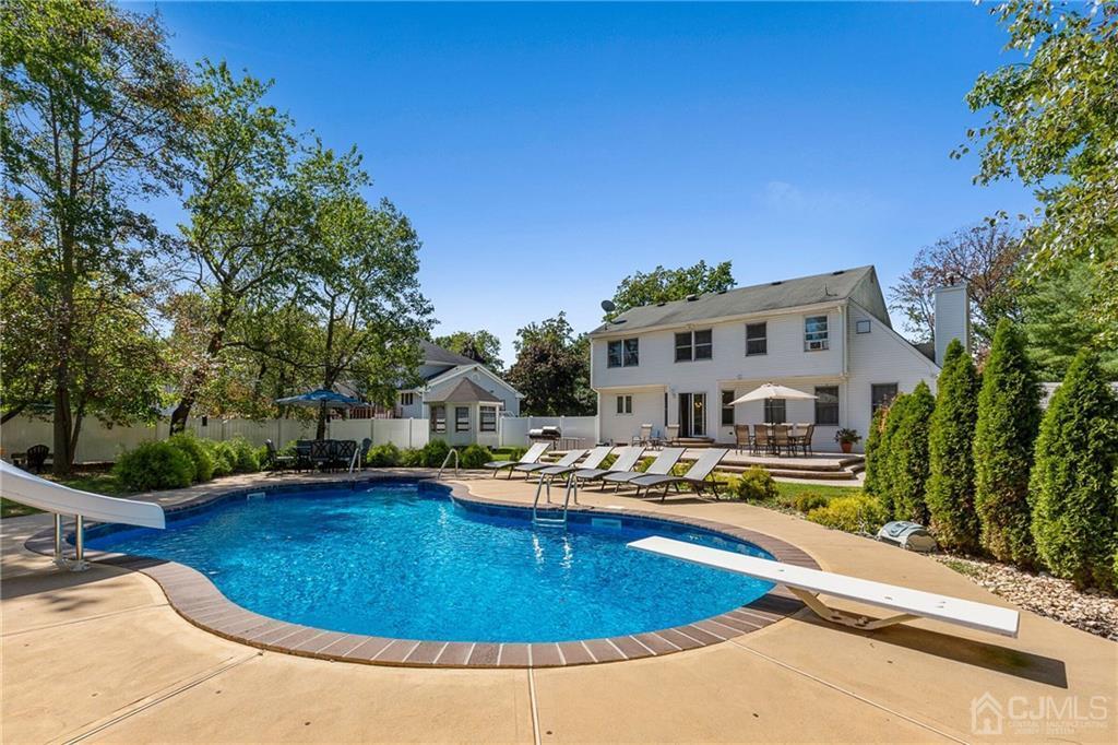 461 Cottrell Road Old Bridge, NJ 08857 - Photo 16 of 21 a swimming pool with outdoor seating and yard