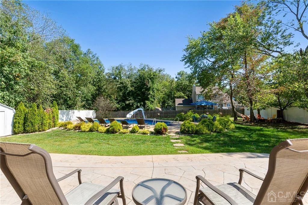 461 Cottrell Road Old Bridge, NJ 08857 - Photo 19 of 21 a view of a chairs and table in the garden