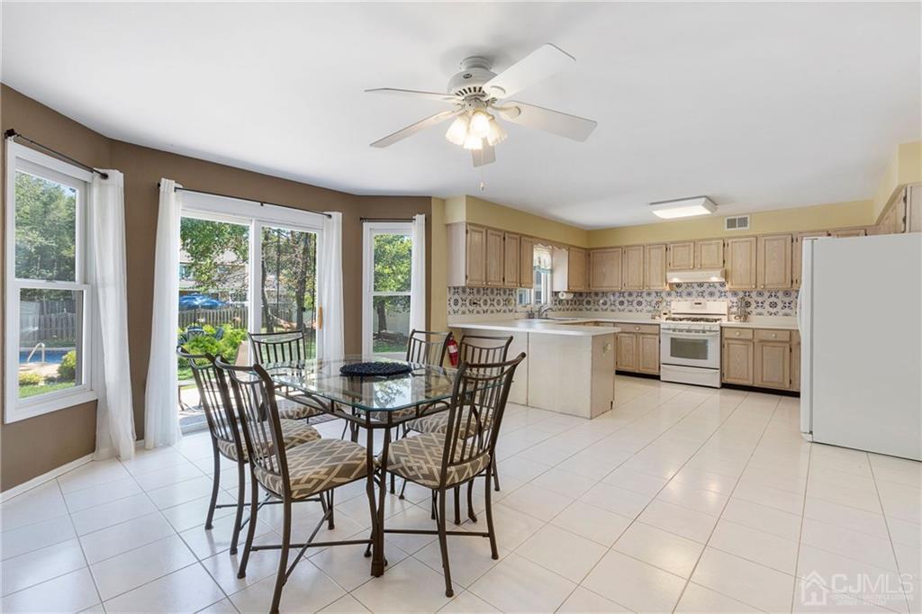 461 Cottrell Road Old Bridge, NJ 08857 - Photo 5 of 21 a view of a dining room and livingroom with furniture a kitchen view