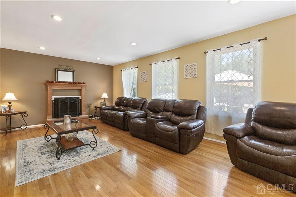 461 Cottrell Road Old Bridge, NJ 08857 - Photo 8 of 21 a living room with furniture and a fireplace